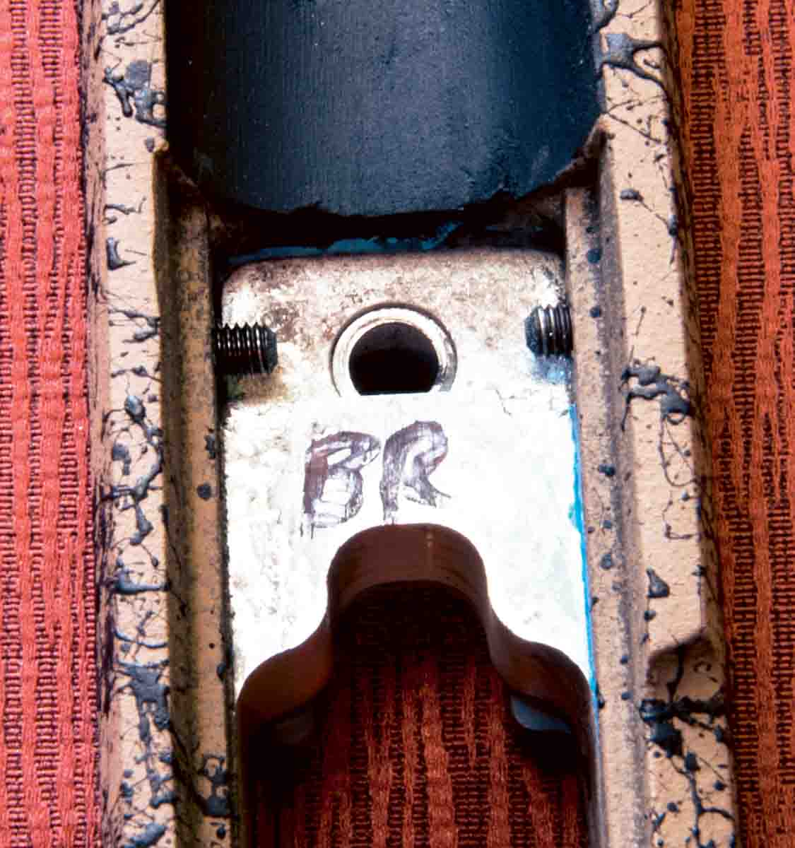 An abbreviated aluminum bedding block helps stiffen the H-S PSS stock. Note the centering screws protruding in where the recoil lug will abutt against the bedding block.